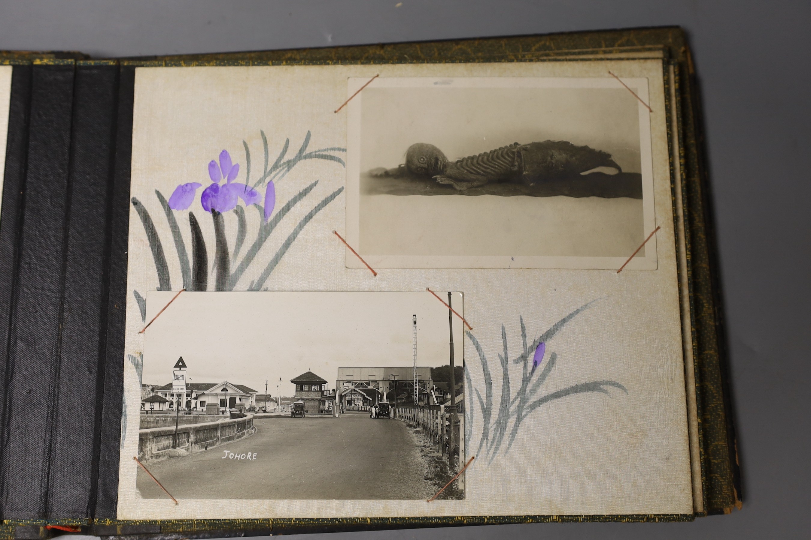 A black lacquer album containing photos of Venice, Penang and China